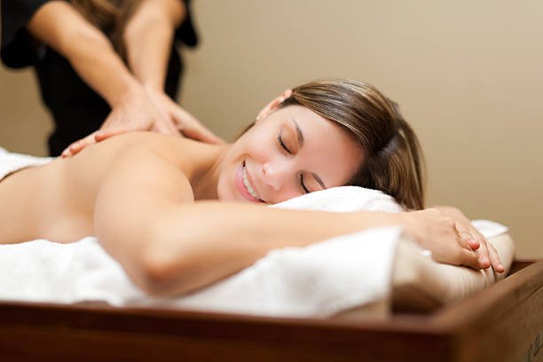 Young woman receiving a massage in a spa